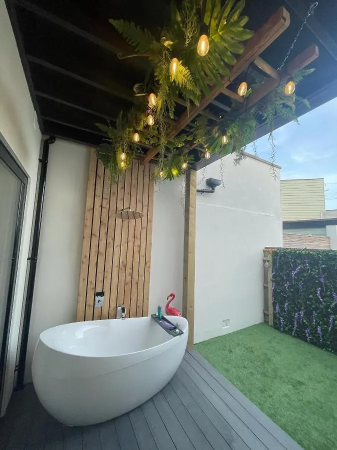 Coastline Retreats: Jungle-Themed Seafront Garden Apartment Bournemouth